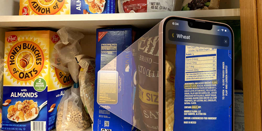 Phone pointed at cereal box with wheat ingredients highlighted